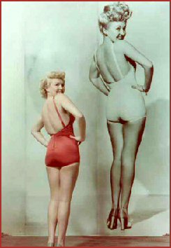 https://groovyhistory.com/betty-grable-young-wwii-pinup-back-shot-legs